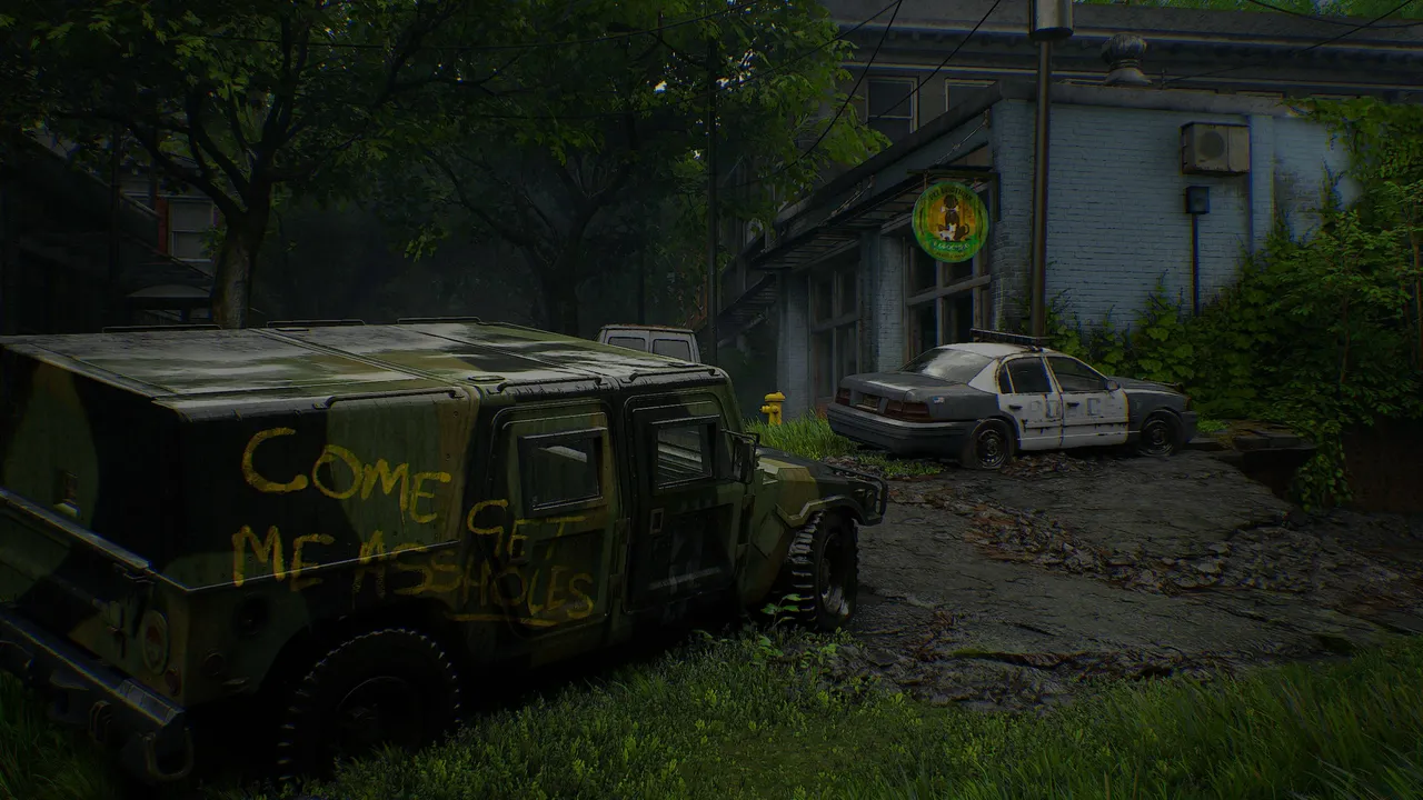 A ruined jeep with graffiti