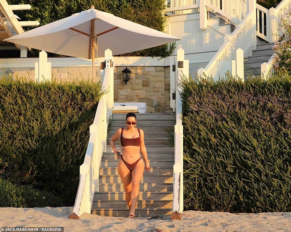 So many steps! The staircase was long and it took a while for Kim to get down the steps but she looked relieved when she finally hit the sandy beach