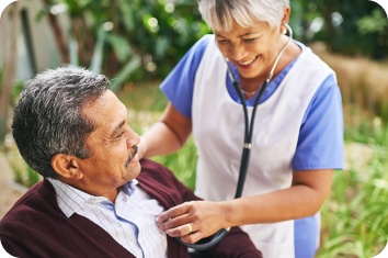 A clinician listening to a patient's heart during a visit