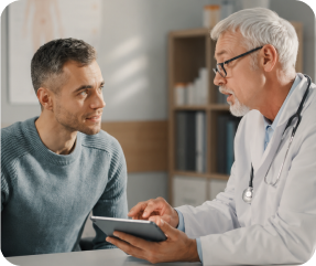 A clinician reviewing a tablet with a patient