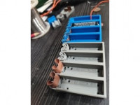 Flexing battery holders with integrated spring terminals 3D model