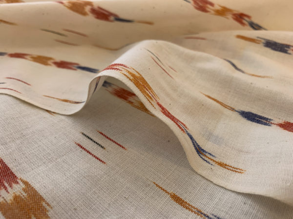 Feathers Cotton Ikat - Primary on Natural