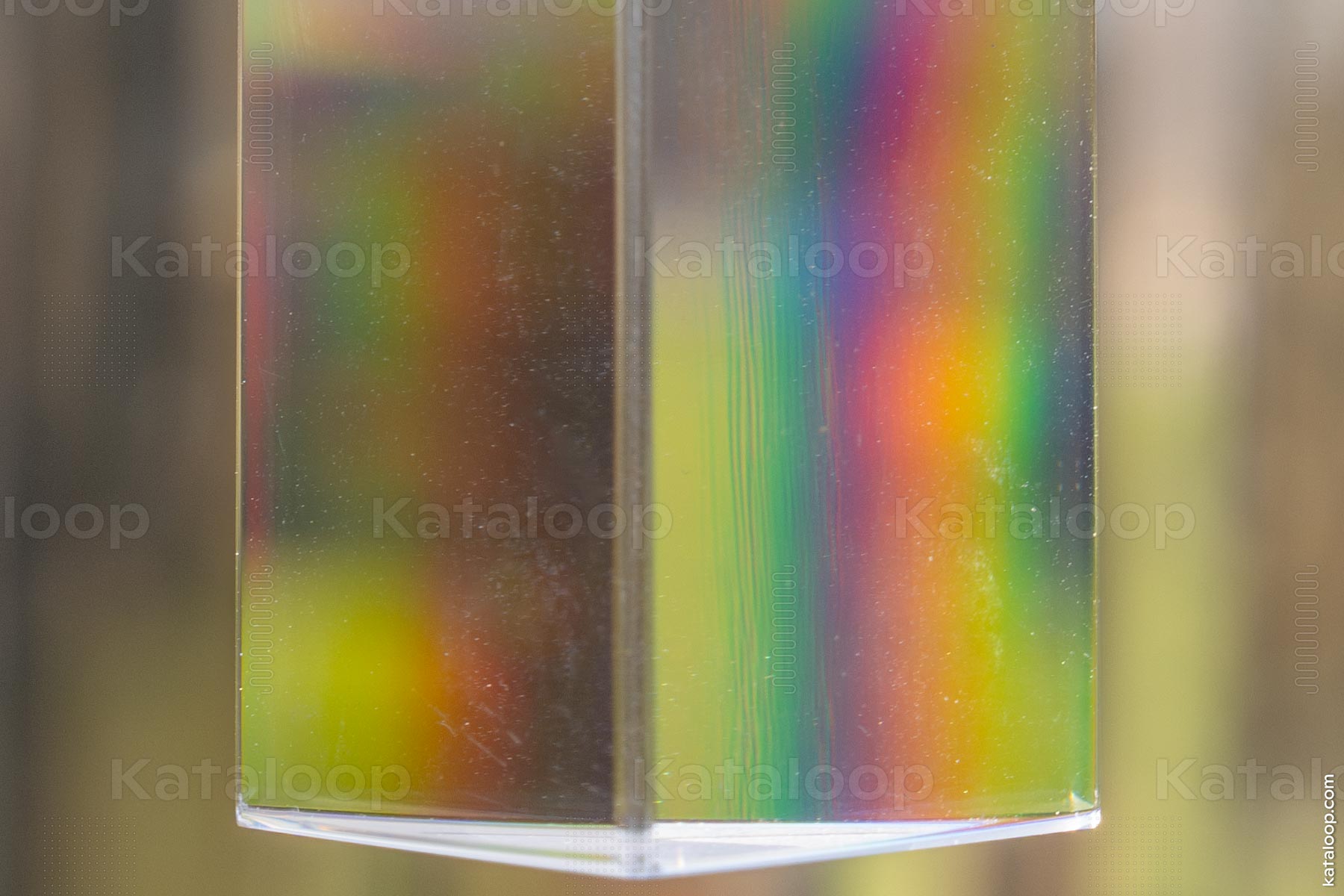Colorful light diffraction through prism in natural setting