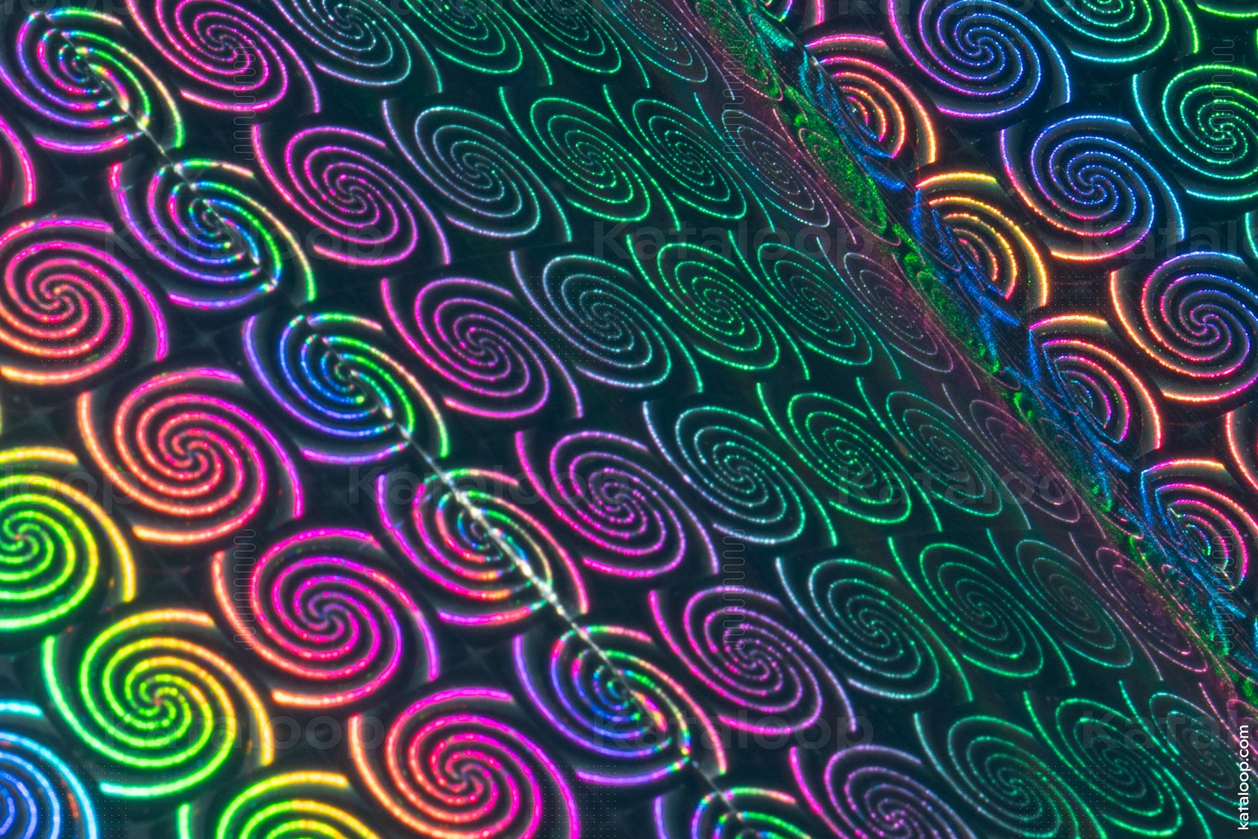 Colorful holographic spiral patterns on textured surface