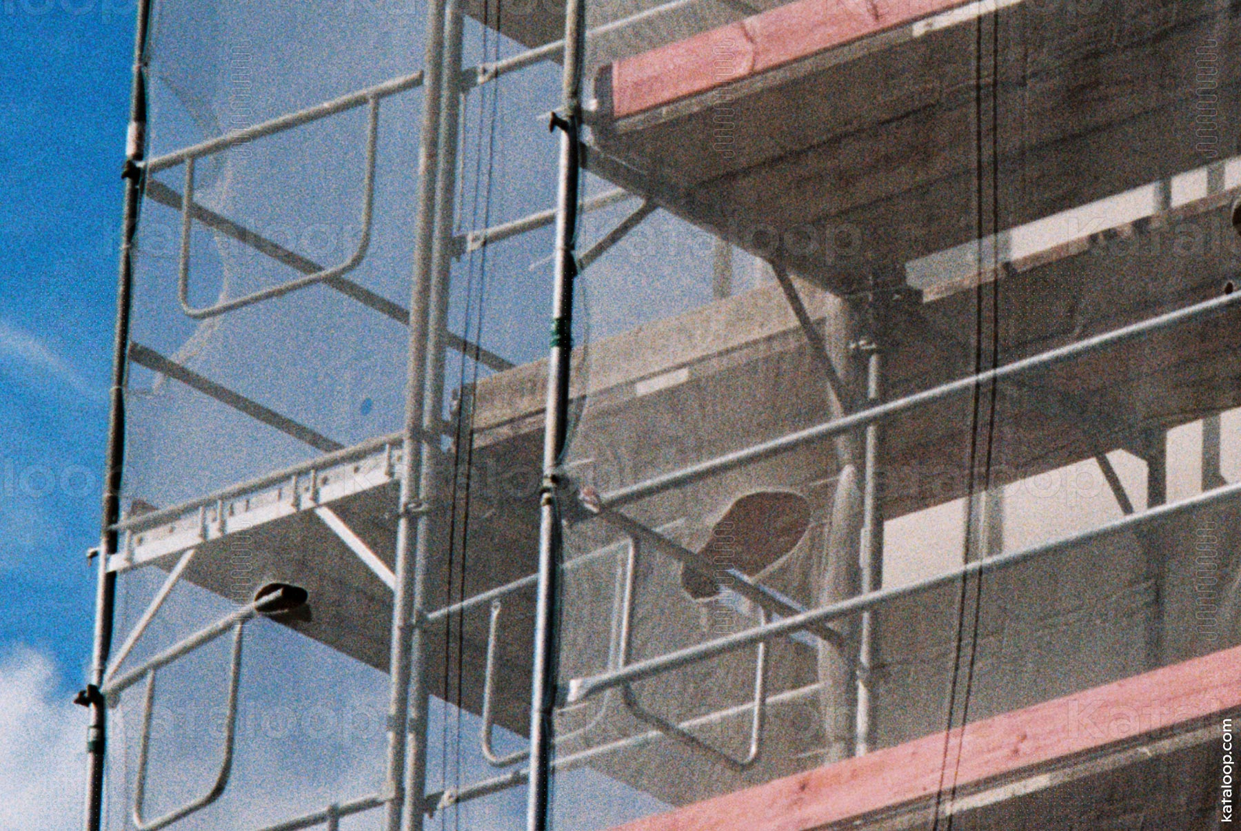Construction scaffolding with protective netting