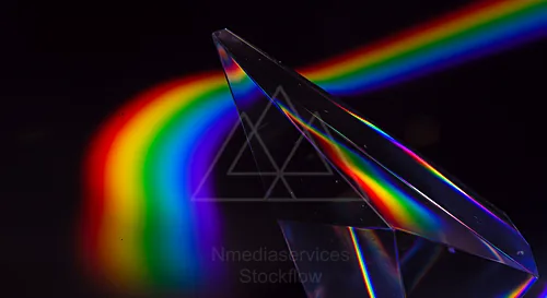 A glass prism refracting light into a vibrant rainbow spectrum — 8K royalty-free background stock photo