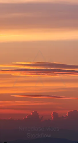 Colorful sunset with layered clouds and soft lighting — 8K royalty-free background stock photo