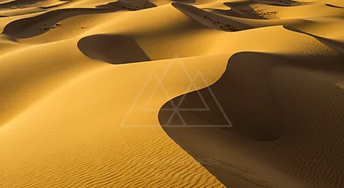Golden sand dunes under soft sunlight creating shadows — 8K royalty-free background stock photo