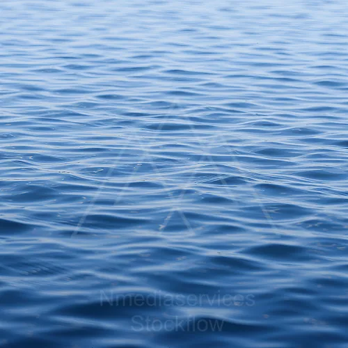 Calm blue water surface with gentle ripples and reflections — 8K royalty-free background stock photo