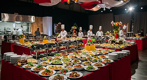 A large buffet spread with chefs preparing food in a well-lit venue — 8K royalty-free catering events stock photo