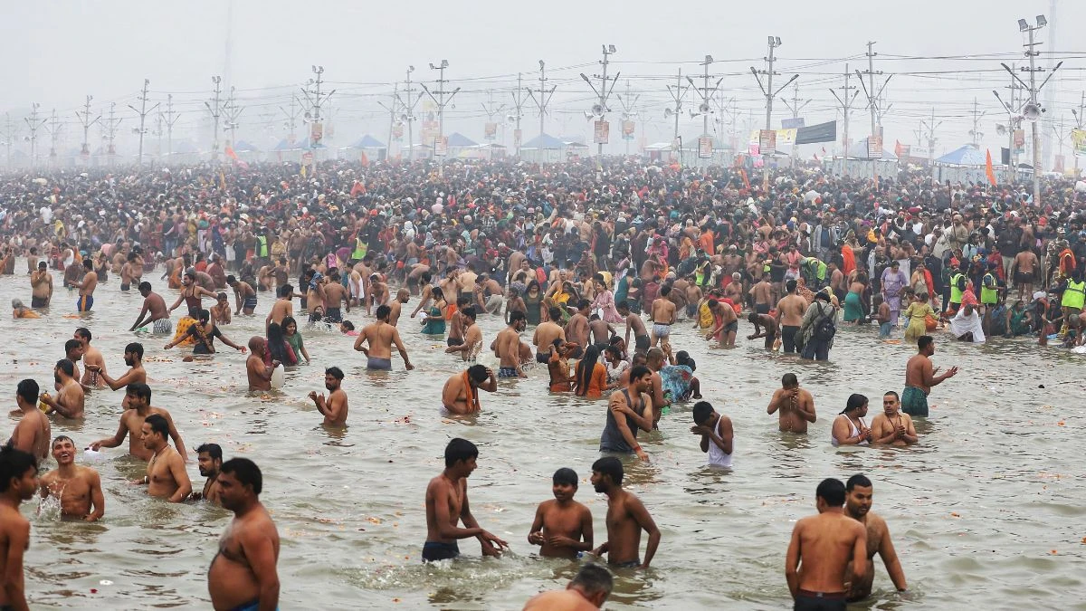 liquor smuggler Pravesh Yadav caught by police taking a dip in Maha Kumbh in Prayagraj