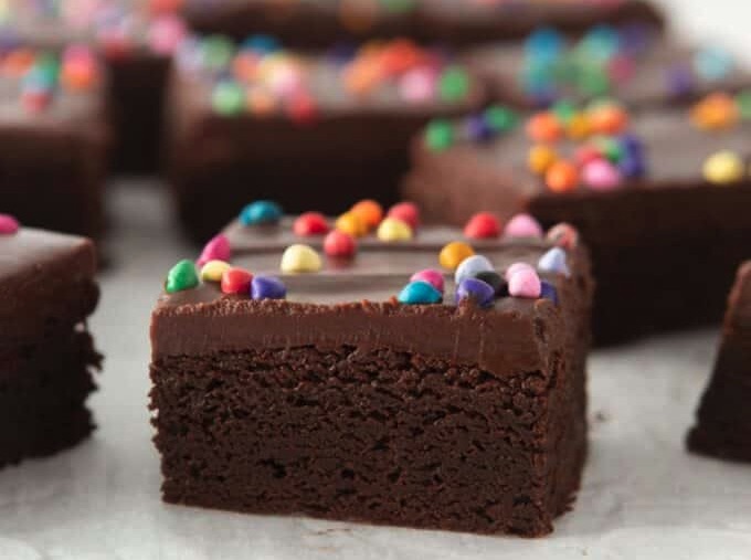 Cosmic Brownies a close up of a brownie with colorful sprinkles