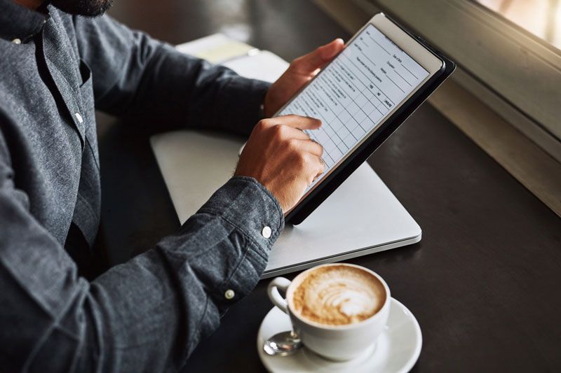 Man conducting a survey by a tablet