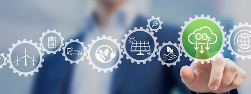 Man pointing at cogs representing sustainability