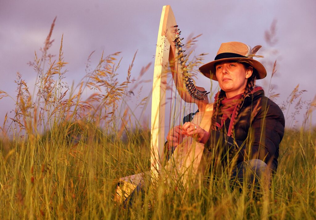 Harpist Morwenna Louttit-Vermaat from Hands on Harps, Stroud welcomed the rising of the midsummer solstice sun on ancient Selsley Common, to the sound of skylarks. Harp2 | Here comes the sun: artists mark the summer solstice