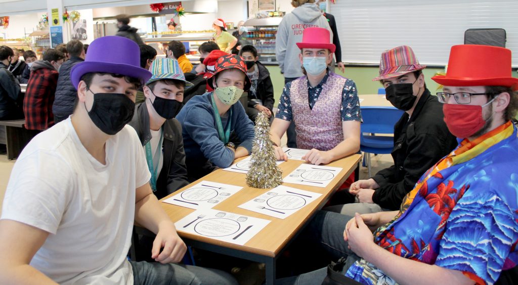Marling sixth formers held a Longest Table Christmas lunch this week as part of a local week-long event to combat loneliness and to raise money for charity. Table with Hats | Marling sixth formers support Longest Table lunch