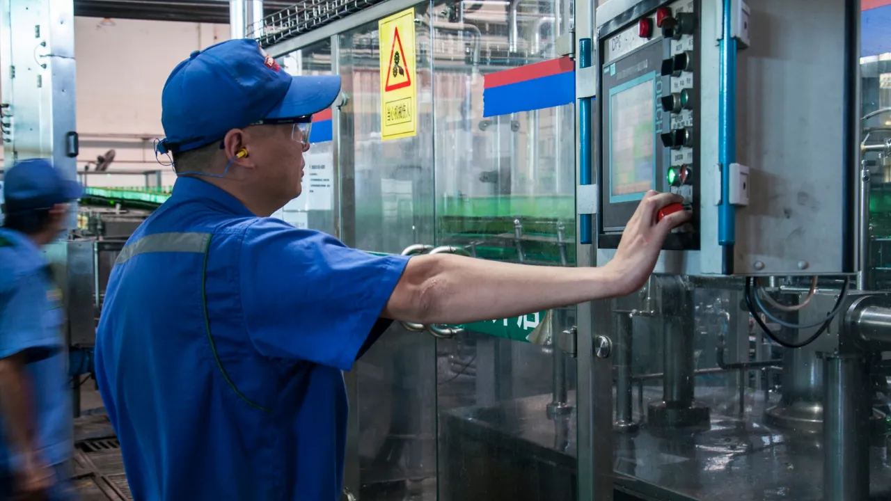 Experienced technician working on manufacturing equipment