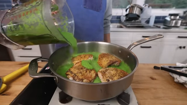 Chicken thighs stewing in salsa verde