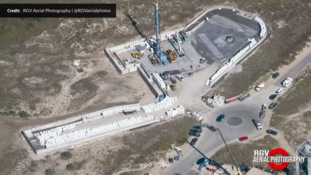 Aerial view of the Air Separation Unit (ASU) construction site, showing deliveries of glass gravel bags for insulation.
