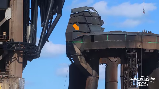 Close-up of the booster quick disconnect at Pad 1 with strips of steel removed for easier dismantling.