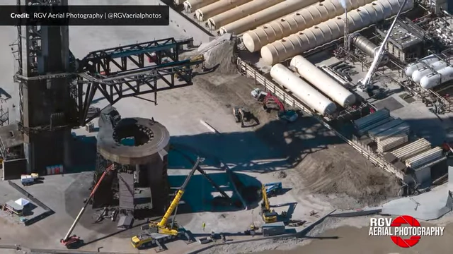 Aerial view of Starbase Pad 1 showing demolition debris and the berm wall concrete being broken up and moved.