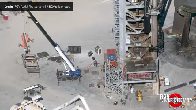 Aerial view of the back of the Starbase tower, showing the drawworks roof and emergency access stairs being cut and removed.