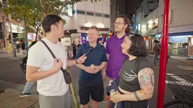 Group of tourists being interviewed in Ni-chome