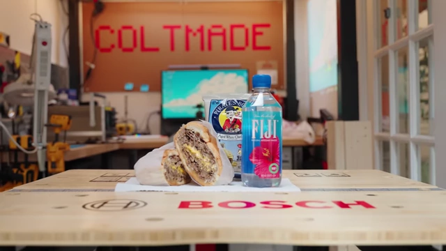 A custom Scooby-Doo lunchbox with a gourmet sandwich, Pirate's Booty, and Fiji water, illustrating the "Lunchbox Theory."