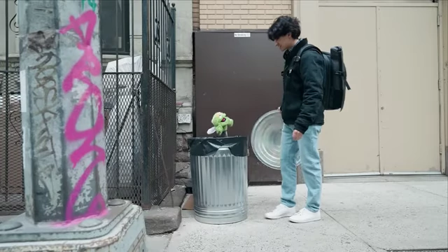 Oscar the Grouch emerging from a trash can, a recurring character adding a "creative edge" to videos.