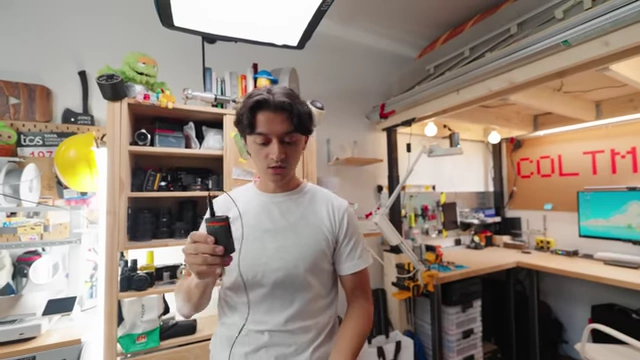 Colt holding the Tentacle Sync Track E with a lavalier microphone, for reliable backup audio.