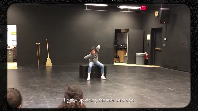 The speaker performing on a stage during her acting days.