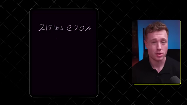 A tablet screen displaying "215lbs @ 20%", illustrating the assumed starting body weight and fat percentage.