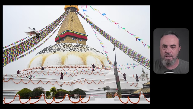 Monks are seen cleaning a large, ornate stupa, with all figures appearing of similar size and importance, conveying collective action.