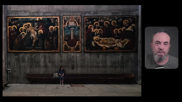 A small girl sits alone on a long bench beneath three large, dark religious paintings, creating a feeling of discomfort due to visual weight.
