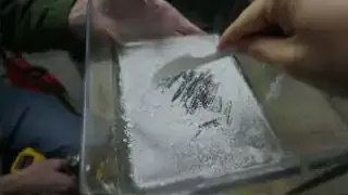 Caffeine crystals scraped from a glass dish after ethanol evaporation.
