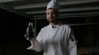 The homemade "Pirate Cola" in a bottle, showcasing its dark color, ready for tasting.