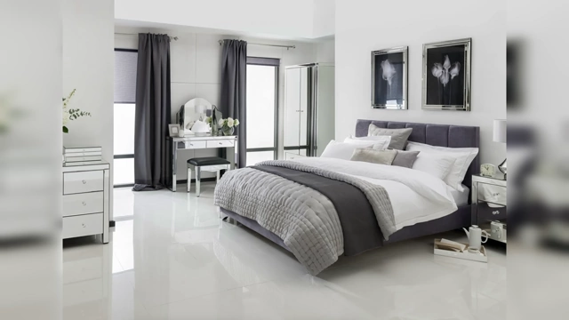 A bedroom with an abundance of glossy surfaces, including shiny floor tiles, mirrored nightstands, and highly reflective picture frames, creating a cold and artificial look.
