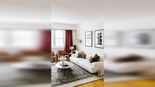 A living room with primarily matte and textured surfaces, featuring a subtle glossy accent from a round coffee table, demonstrating effective balance.