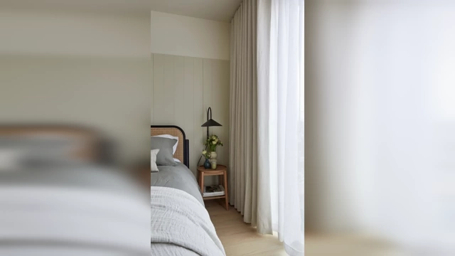 A pair of curtains pulled wide to frame a window, demonstrating ample fabric and proper width for a full look.