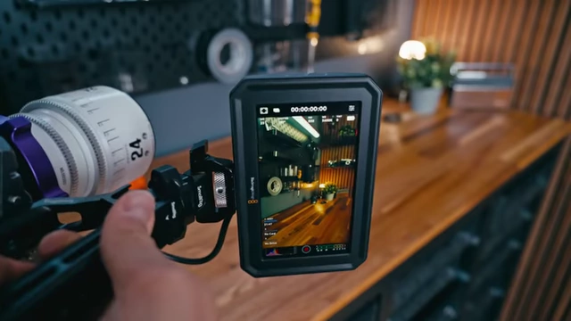 The Blackmagic PYXIS monitor displaying the UI in vertical/portrait orientation, demonstrating auto-rotation