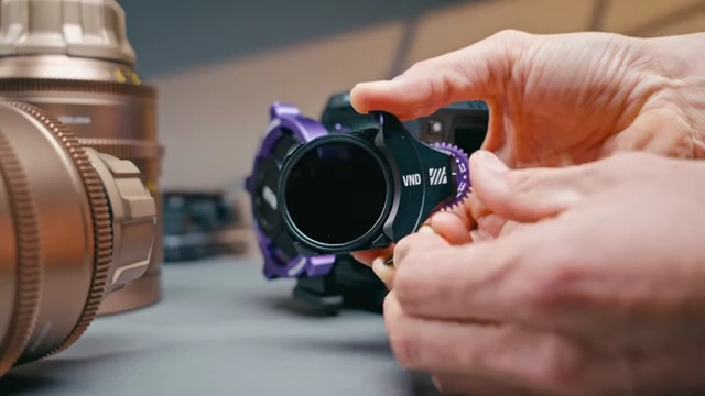 A Mofage Poco PL adapter with a variable ND filter inserted, illustrating a solution for internal NDs