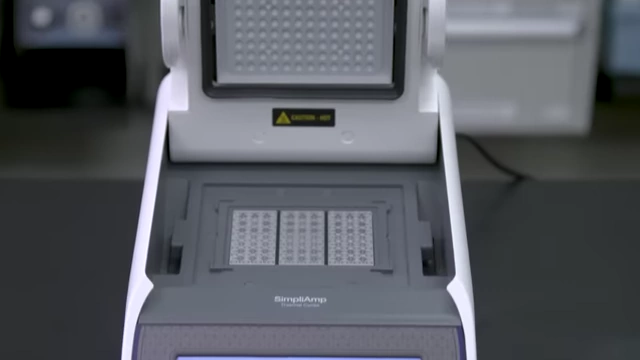 A qPCR machine with samples being loaded.