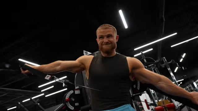 Jeff Nippard demonstrates lateral raises, emphasizing the importance of side delts for a wide, 3D shoulder appearance.