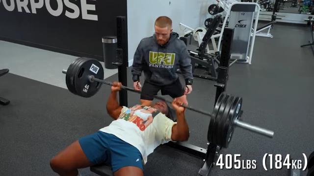 Shemar performs a bench press with heavy weight, showcasing the effectiveness of the exercise for chest development.