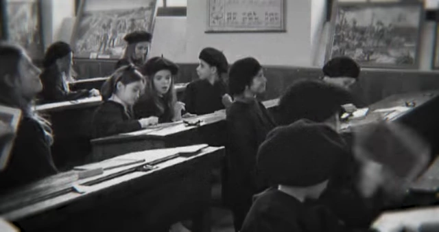 A black and white archival photo of children in a classroom, representing Lassus's background as the son of a teacher.), Lassus gained experience in electronics at Bull Anjou [<a href="https://youtube.com/watch?v=2wMxldl3Alk&t=420">7:00</a>] (Image