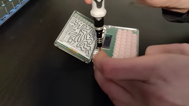 Screws being tightened during the final assembly of the PDA