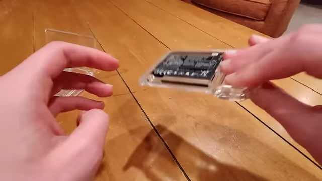The e-ink screen being attached and the PCB assembly in progress