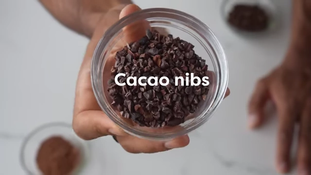 Cacao nibs are shown as a raw form of chocolate.