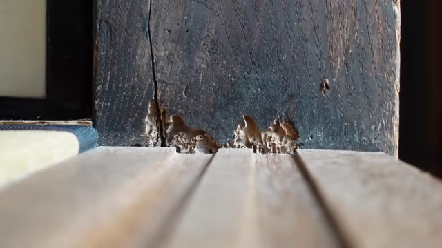 Details of a poorly maintained traditional Japanese house, showing worn wood