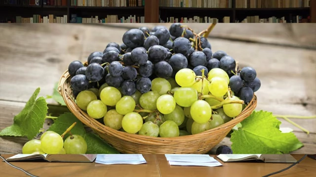 A basket overflowing with green and purple grapes, symbolizing abundant fruit and positive qualities.